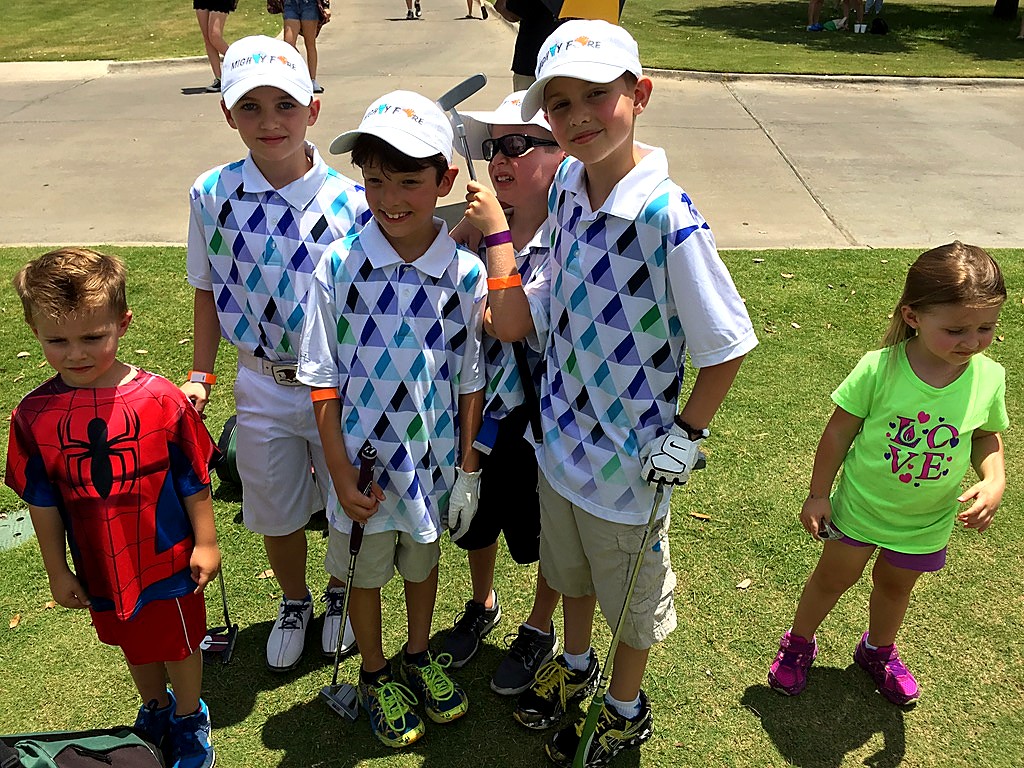 Andrew Hillman. Mighty Fore team at KidSwing. Matching Mighty Fore polos and hats.