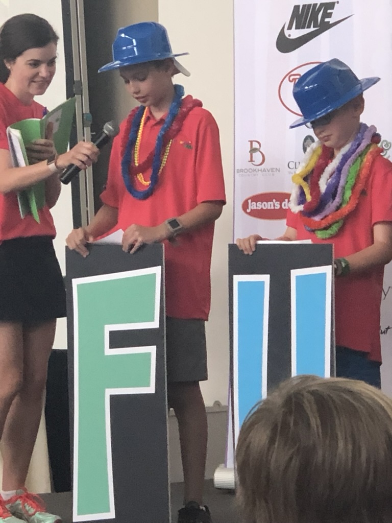 Andrew Hillman. KidSwing stage. Letter signs and in-kind sponsors.