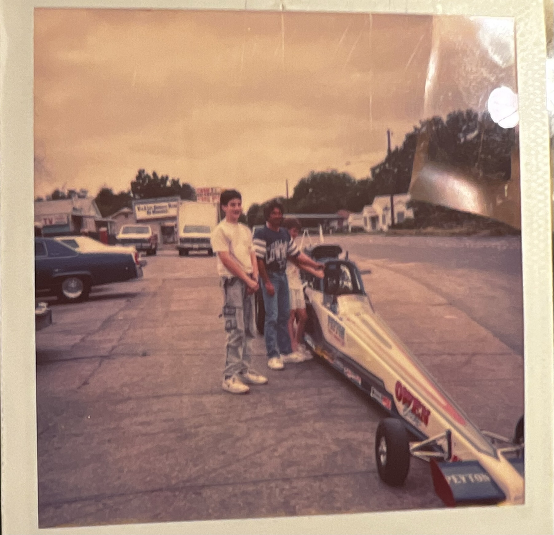 Andrew Hillman. Andrew as a younger person with a race car, selling raffle tickets for the Oak Cliff Lions Club.