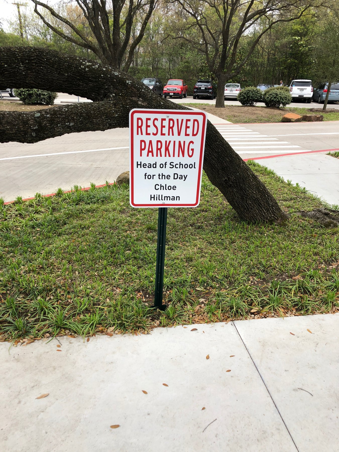 Andrew Hillman. Chloe Hillman Head of School for the Day reserved parking sign on campus. RESERVED PARKING, Head of School for the Day, Chloe Hillman.